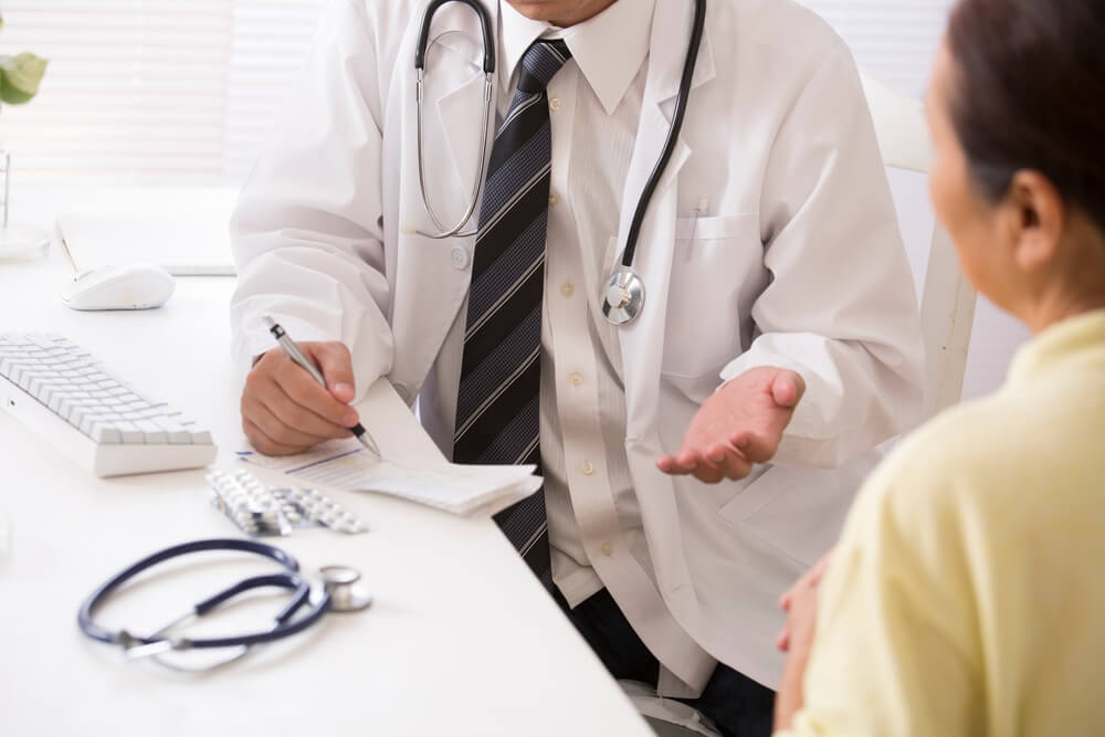 Medical billing professional reviewing EOB and insurance claim reimbursement details