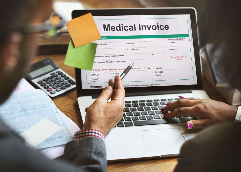 payment posting specialist explaining medical invoice