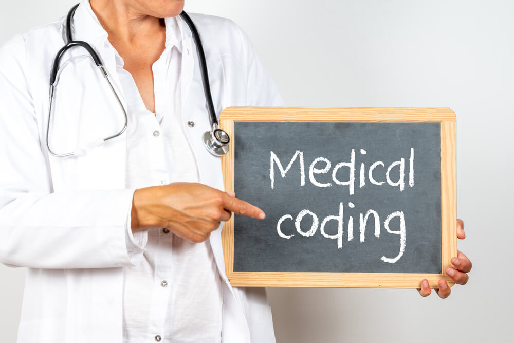 Remote medical coding professionals reviewing patient charts and insurance claims to improve billing accuracy and compliance for healthcare practices.
