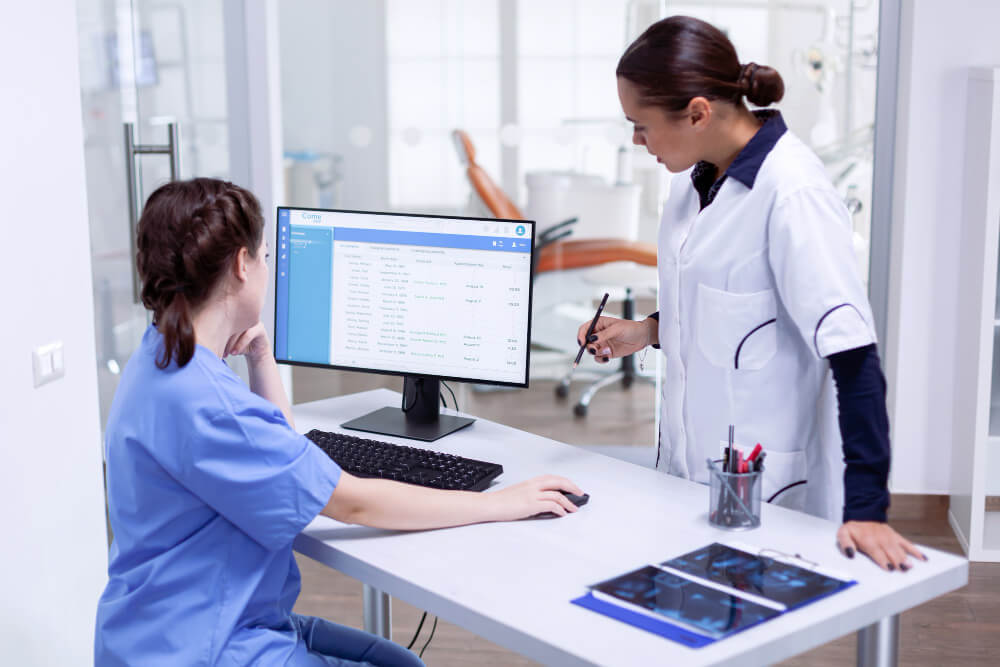 Medical professional reviewing insurance documents to obtain prior authorization before performing a procedure.