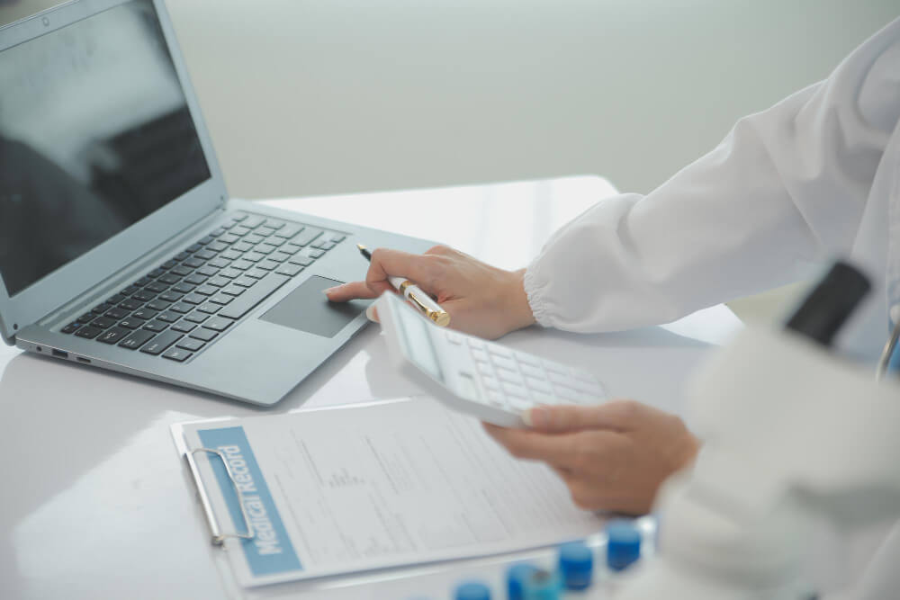 Healthcare professional reviewing insurance claims for accuracy and completeness to ensure clean claim submission.