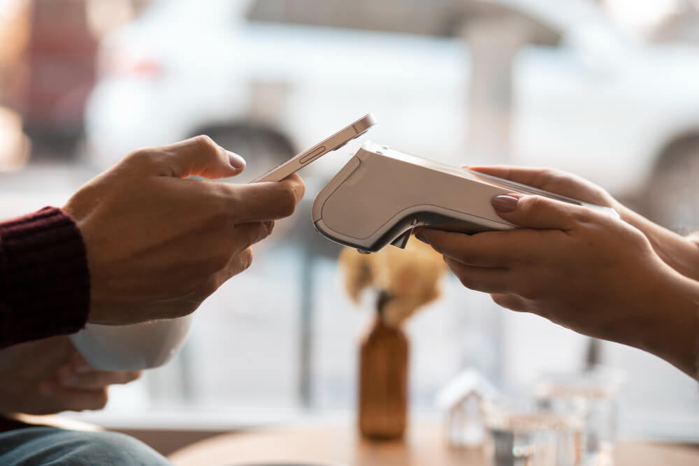Patient making a medical payment while reviewing hospital billing and insurance coverage details.